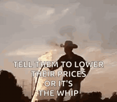 A Man In A Cowboy Hat Is Standing In Front Of A Fire Holding A Whip . GIF