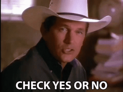 A Man In A Cowboy Hat Is Standing In Front Of A Pile Of Papers And Says Check Yes Or No . GIF