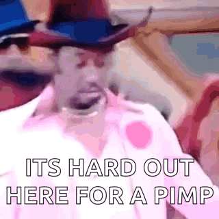 A Man In A Cowboy Hat Is Standing In Front Of A Sign That Says `` Its Hard Out Here For A Pimp '' GIF