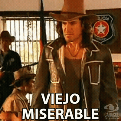 a man in a cowboy hat is standing in front of a sign that says policia