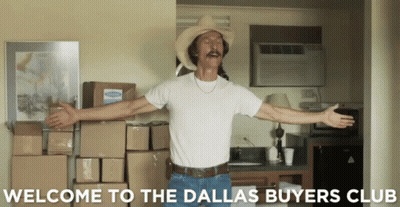 A Man In A Cowboy Hat Is Standing In Front Of Boxes And The Words Welcome To The Dallas Buyers Club GIF