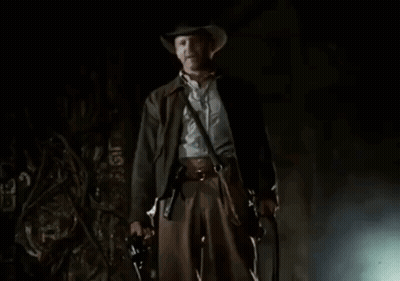 A Man In A Cowboy Hat Is Standing In Front Of The Word Part GIF