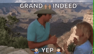 A Man In A Cowboy Hat Is Talking To A Woman In Front Of The Grand Canyon GIF