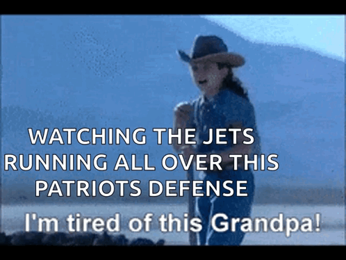 A Man In A Cowboy Hat Is Watching The Jets Running All Over This Patriots Defense GIF