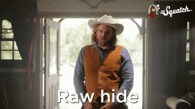 A Man In A Cowboy Hat Stands In Front Of A Door With The Words Raw Hide Written On The Bottom GIF