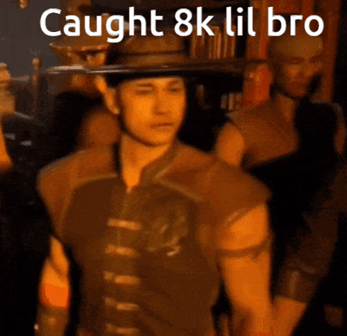 A Man In A Cowboy Hat With The Words Caught 8K Lil Bro Written Above Him GIF