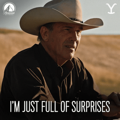 A Man In A Cowboy Hat With The Words I 'M Just Full Of Surprises Below Him GIF