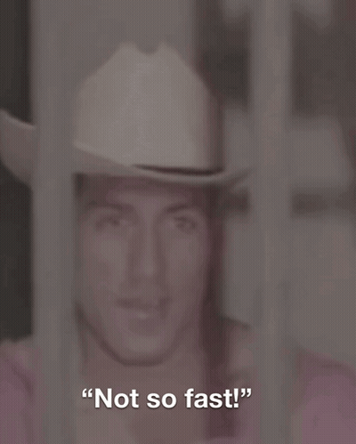 A Man In A Cowboy Hat With The Words " Not So Fast " Behind Him GIF