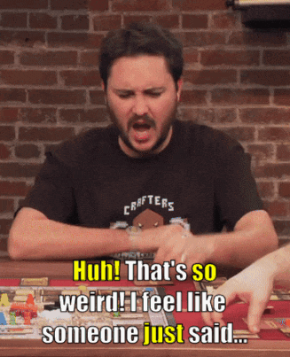 A Man In A Crafters Shirt Is Sitting At A Table GIF
