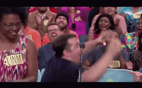 A Man In A Crowd With A Name Tag That Says Lindm GIF