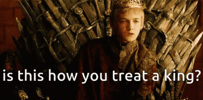 A Man In A Crown Sits On A Throne With The Words " Is This How You Treat A King " GIF