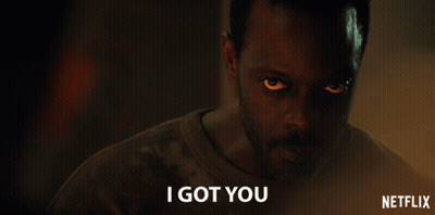 A Man In A Dark Room With A Netflix Logo In The Corner GIF