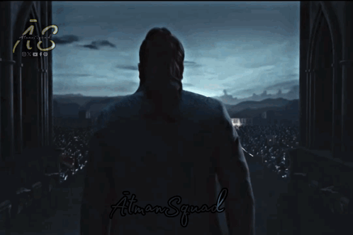 A Man In A Dark Room With The Word May Written On It GIF