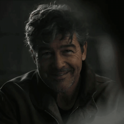 A Man In A Dark Room With The Words Green Lantern On The Bottom GIF