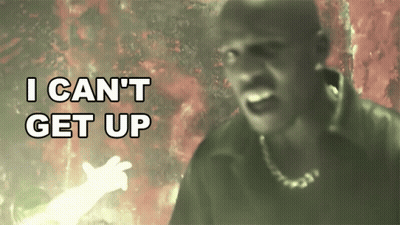 A Man In A Dark Room With The Words I Can 'T Get Up Behind Him GIF