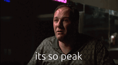 A Man In A Dark Room With The Words It 'S So Peak Below Him GIF