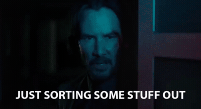 A Man In A Dark Room With The Words `` Just Sorting Some Stuff Out '' Written On The Bottom . GIF