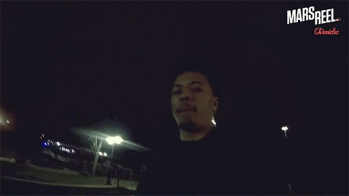 A Man In A Dark Room With The Words Mars Reel On The Bottom Right GIF