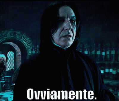 A Man In A Dark Room With The Words Ovviamente Written On The Bottom GIF