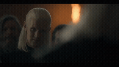 A Man In A Dark Room With The Words Say It Below Him GIF