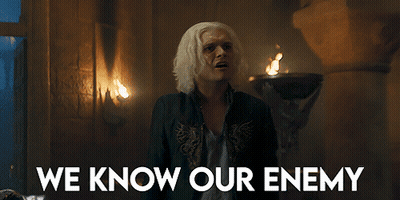 A Man In A Dark Room With The Words We Know Our Enemy Above Him GIF