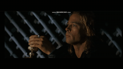 A Man In A Dark Room With The Words We Men Are Wretched Things Above Him GIF