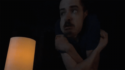 A Man In A Dark Room With The Words When Is The Power Coming Back On Above Him GIF