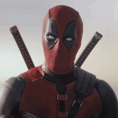 A Man In A Deadpool Costume Has Two Swords Hanging From His Shoulders GIF