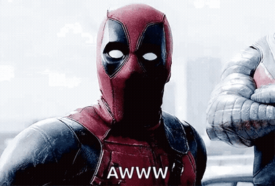 A Man In A Deadpool Costume Is Giving A Thumbs Up And Says Awww . GIF