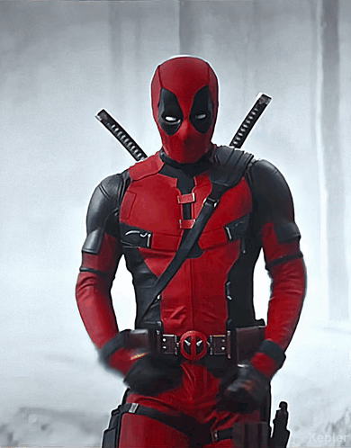 A Man In A Deadpool Costume Is Holding A Gun GIF