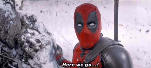 A Man In A Deadpool Costume Says " Here We Go ... " GIF