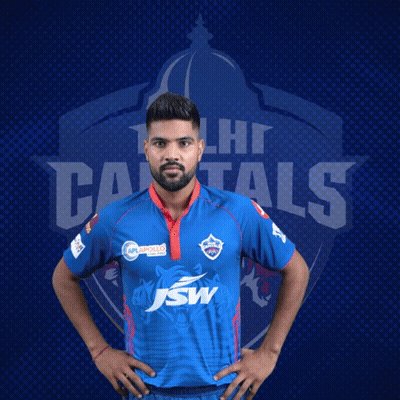 A Man In A Delhi Capitals Jersey Poses For A Photo GIF