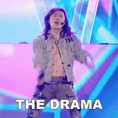 A Man In A Denim Jacket Is Dancing On A Stage With The Word The Drama Below Him GIF