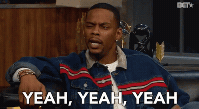 A Man In A Denim Jacket Is Sitting On A Couch And Says Yeah Yeah Yeah GIF