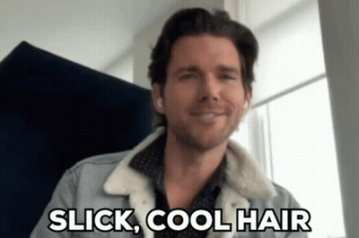 A Man In A Denim Jacket Is Smiling And Says Slick Cool Hair . GIF