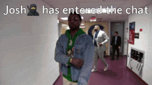 A Man In A Denim Jacket Is Standing In A Hallway With The Caption " Josh Has Entered The Chat " GIF