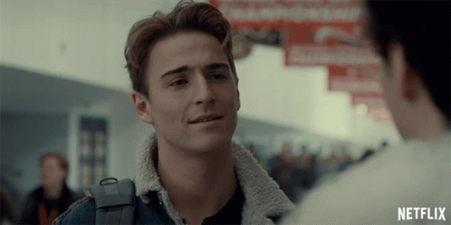 A Man In A Denim Jacket Is Talking To Another Man With A Netflix Logo In The Corner GIF