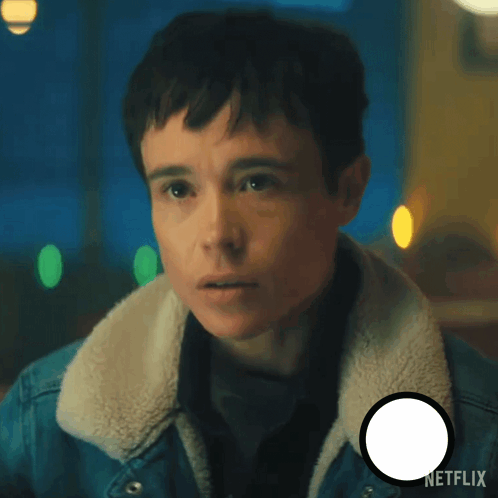 A Man In A Denim Jacket Says They 'Re The Netflix Logo In The Corner GIF