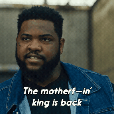 A Man In A Denim Jacket With The Words The Motherf-In King Is Back Below Him GIF