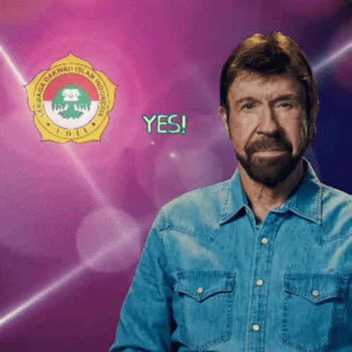 A Man In A Denim Shirt Is Standing In Front Of A Logo That Says Yes GIF