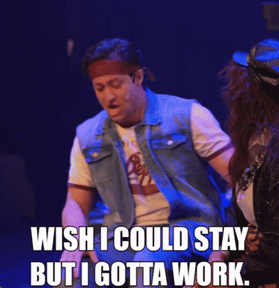 A Man In A Denim Vest Says " Wish I Could Stay But I Gotta Work " On Stage GIF