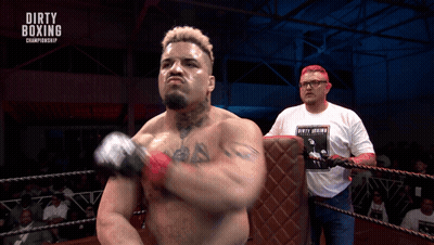 A Man In A Dirty Boxing Championship Shirt GIF
