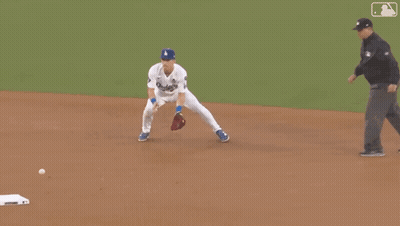 A Man In A Dodgers Jersey Is Running On The Field GIF