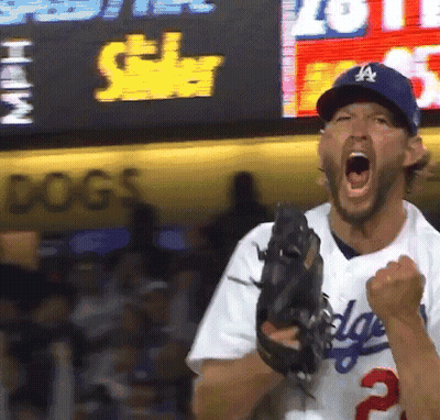A Man In A Dodgers Uniform Is Holding A Baseball Glove GIF