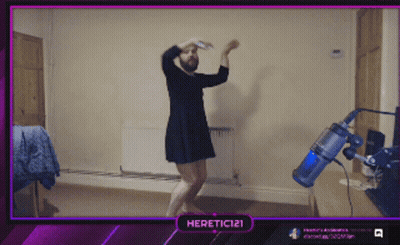 A Man In A Dress Is Dancing In Front Of A Vacuum Cleaner And A Purple Border That Says Heretic121 GIF