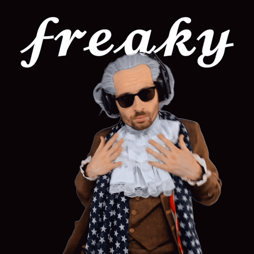 A Man In A Fancy Dress Costume With The Word Freaky Behind Him GIF
