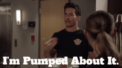 A Man In A Fireman 'S Shirt Says I 'M Pumped About It While Talking To A Woman GIF