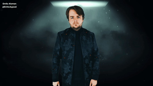A Man In A Floral Jacket Is Standing In Front Of A Sign That Says D GIF