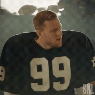A Man In A Football Jersey With The Number 99 On It . GIF
