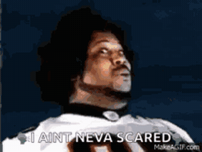 A Man In A Football Uniform Is Looking Up And Saying I Ain T Neva Scared . GIF